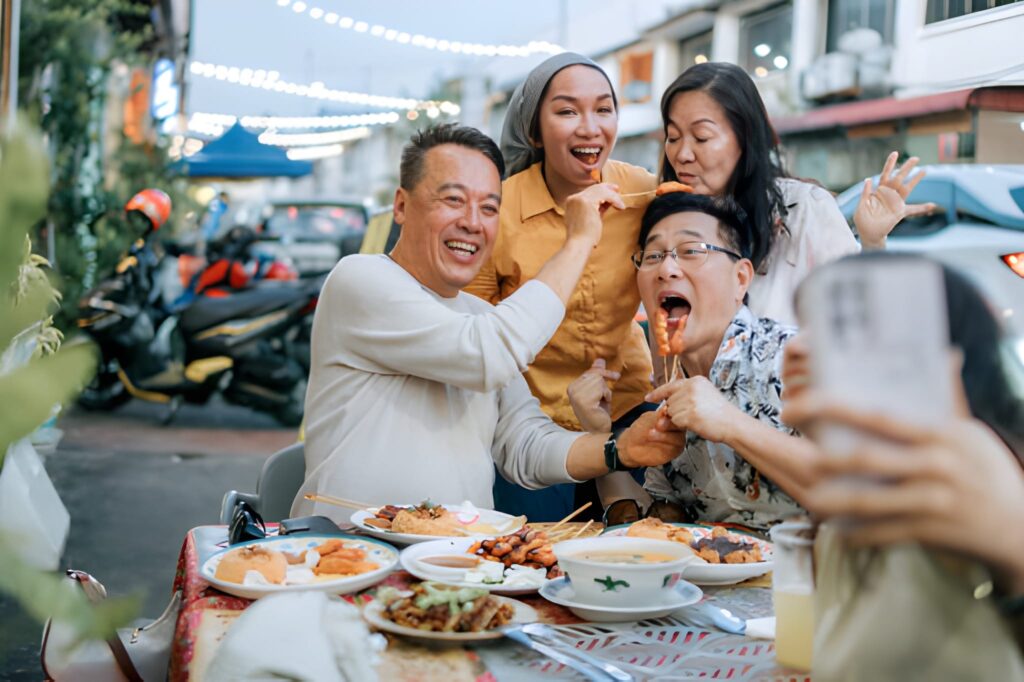 Summit attendees enjoying Cypriot cuisine and traditional music at a local restaurant after conference sessions.