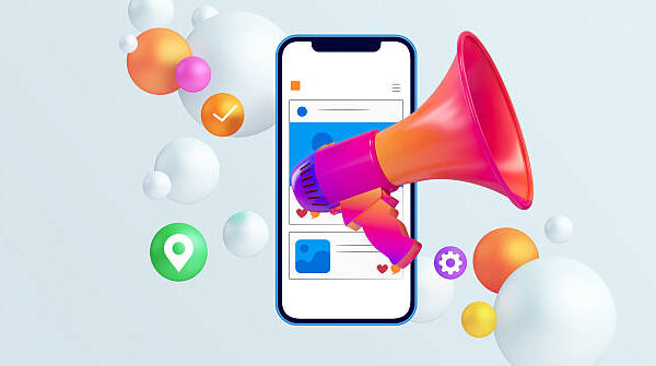 A vibrant 3D illustration showcasing the concept of digital marketing and social media promotion. A colorful megaphone points directly at a smartphone displaying a social media feed, symbolizing the amplification of a message to a wide audience. Floating icons like location pins, check marks, and settings buttons represent app functionality and customer engagement. This modern and dynamic image is perfect for technology companies, marketing agencies, and businesses looking to illustrate concepts of online advertising, content creation, influencer marketing, and brand growth in the digital age.