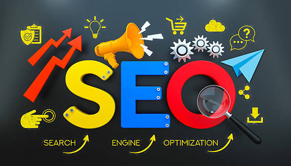This informative 3D Render visualizes a comprehensive Search Engine Optimization (SEO) Strategy. The Acronym "SEO" is displayed in vibrant Yellow, Blue, and Red Colors against a Dark Gray Background, with the terms "Search," "Engine," and "Optimization" highlighted below. The Concept is surrounded by various Icon and Symbol elements representing key Marketing activities such as Searching (with a Magnifying Glass), Broadcasting (megaphone), e-commerce (Add To Cart), technical processes (Gear - Mechanism), Cloud Computing, Communication (Speech Bubble), generating Ideas (Light Bulb), Sharing, and Downloading. Upward Arrow Symbols signify Growth and Development, underscoring the Performance goals of SEO in Online Advertising and Digital Transformation.
