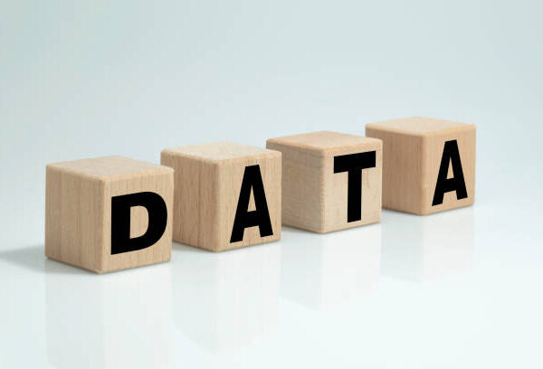 Wooden cubes spelling Data. Tech concept and business investment decisions concept.