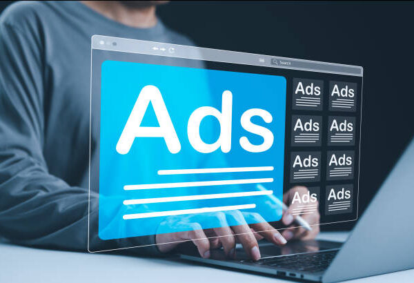 Analyzing Online Advertising Campaigns. A person using a laptop with multiple digital Ad windows on screen symbolizes online advertising analysis and campaign management. AD on website, Ads campaign,