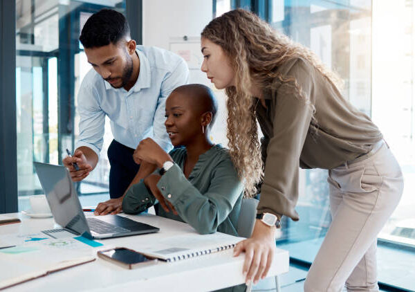 The digital marketing conference 1 Team collaboration, online marketing and laptop planning for ideas, inspiration and strategy in startup company. Business people in diversity group working, meeting and discussion with internet tech