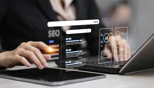 Businessperson analyzing SEO dashboard with search bar, keyword rankings, data charts and optimization analytics.